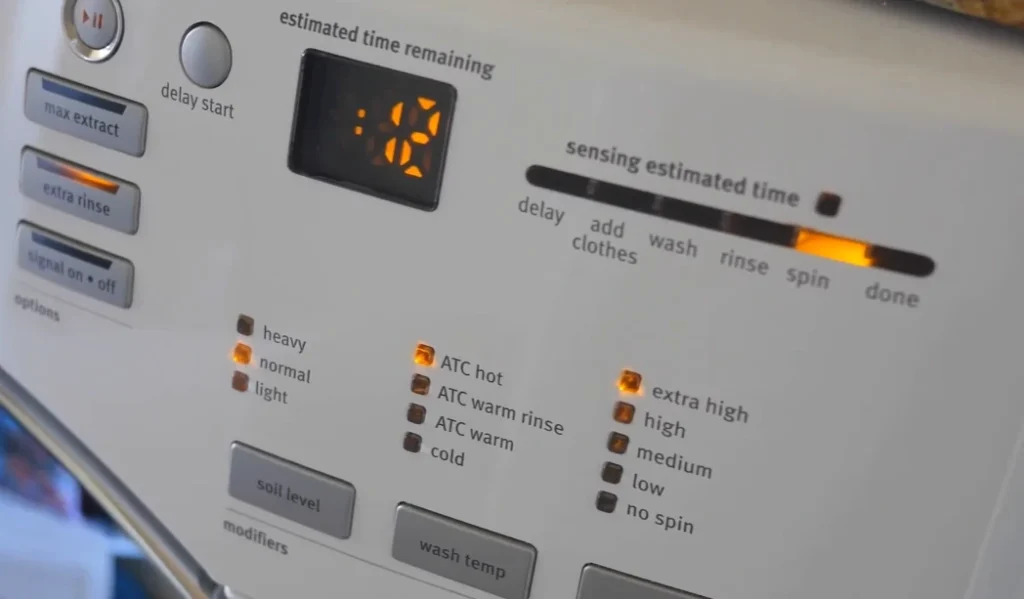 Close-up of dryer timer showing extended drying cycle problem