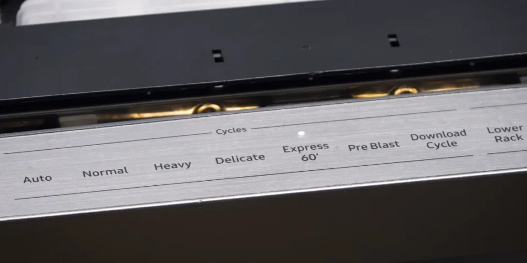 Close-up of dishwasher control panel with multiple cycle options and settings.